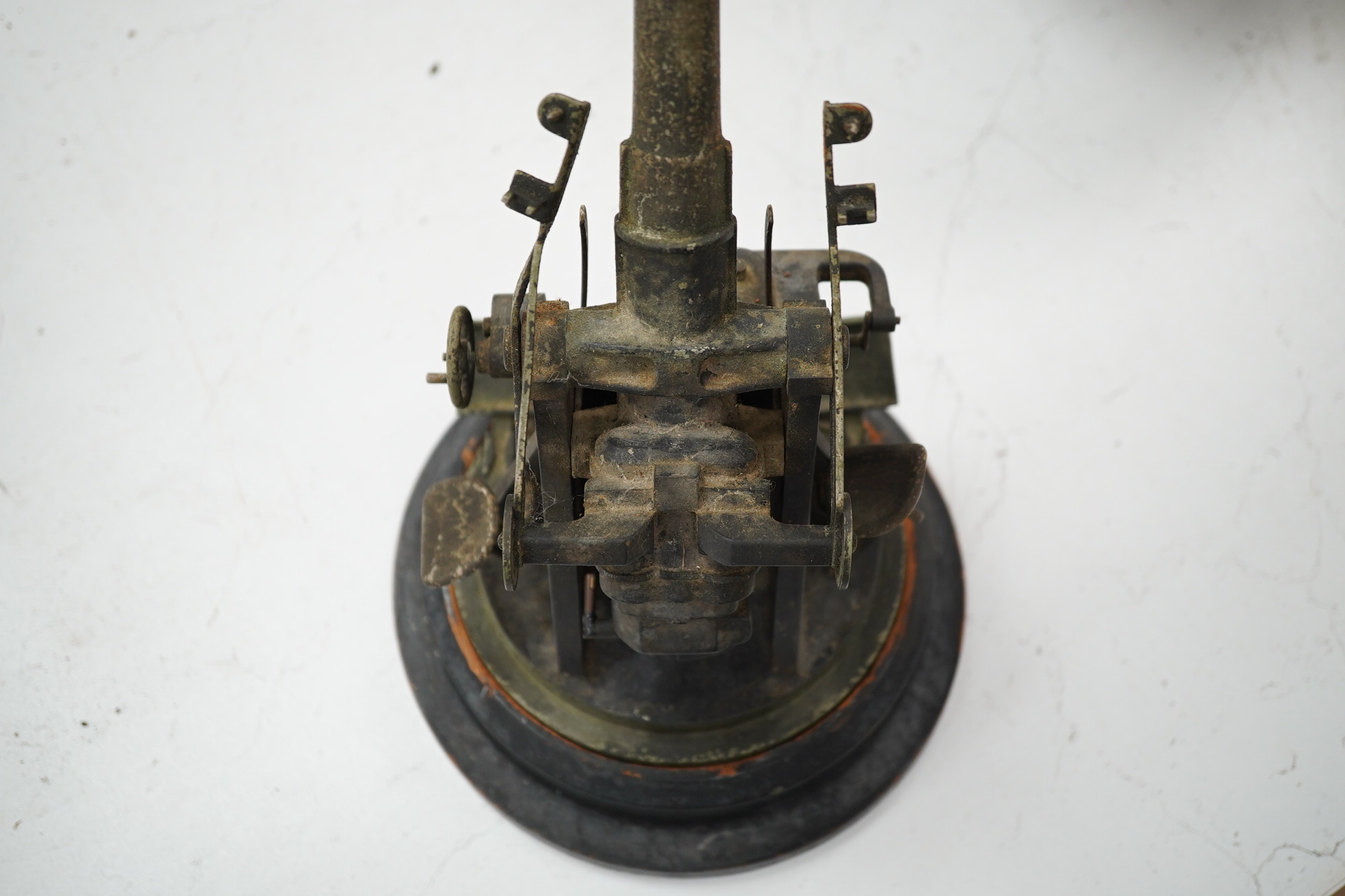 A steel model of a First World War 4 inch mark IX E.O.C. anti-aircraft gun, barrel 18cm, on a turned ebonised pine base with applied label. Condition - fair, some wear overall.